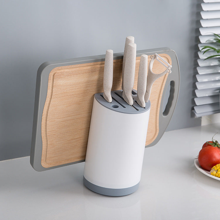 White kitchen knife storage rack with chopping board holder