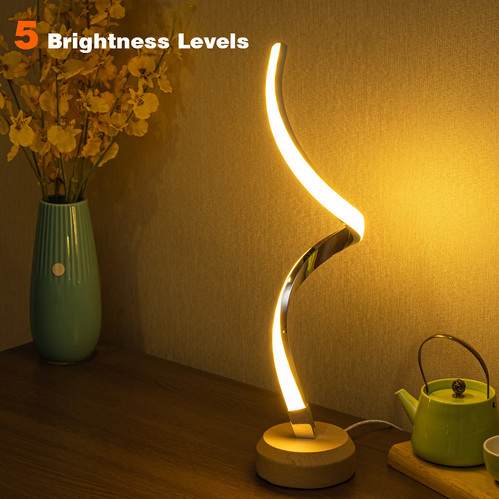 LED spiral table lamp with modern curved design
