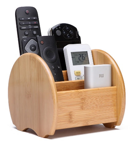 Bamboo remote and desk organizer holding remote controls and small accessories