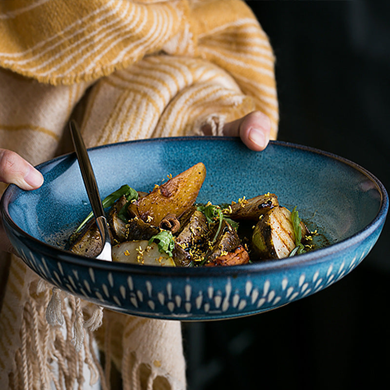 Blue ceramic serving bowl with food for modern kitchen and dining