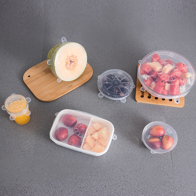Reusable silicone food covers stretched over bowls
