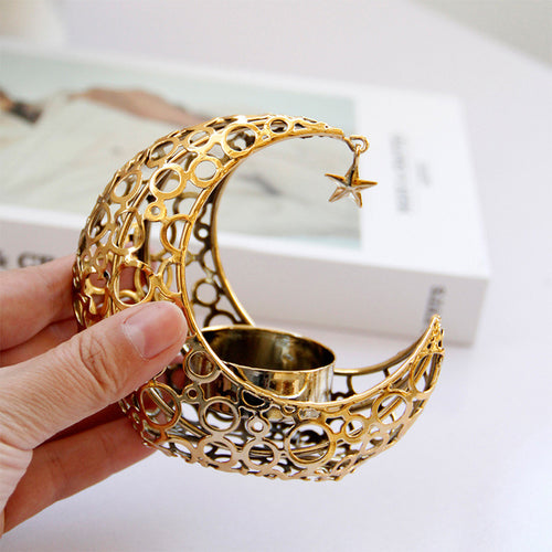 Black and gold crescent moon candle holders for table décor
